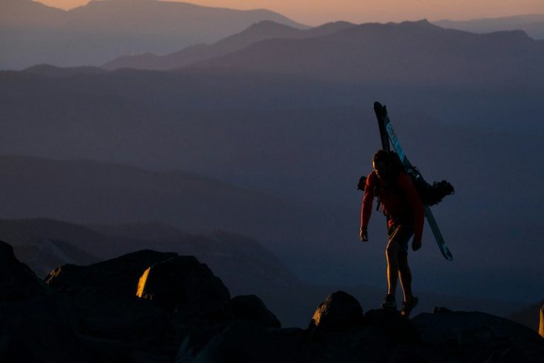 "Lone traveler walking mountain path — symbol of Jia Shen's destiny journey"